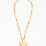 Twisted gold chain with large gold bubble heart pendant.