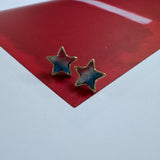 Pair of star studs with red, white and blue druzy stone interiors.