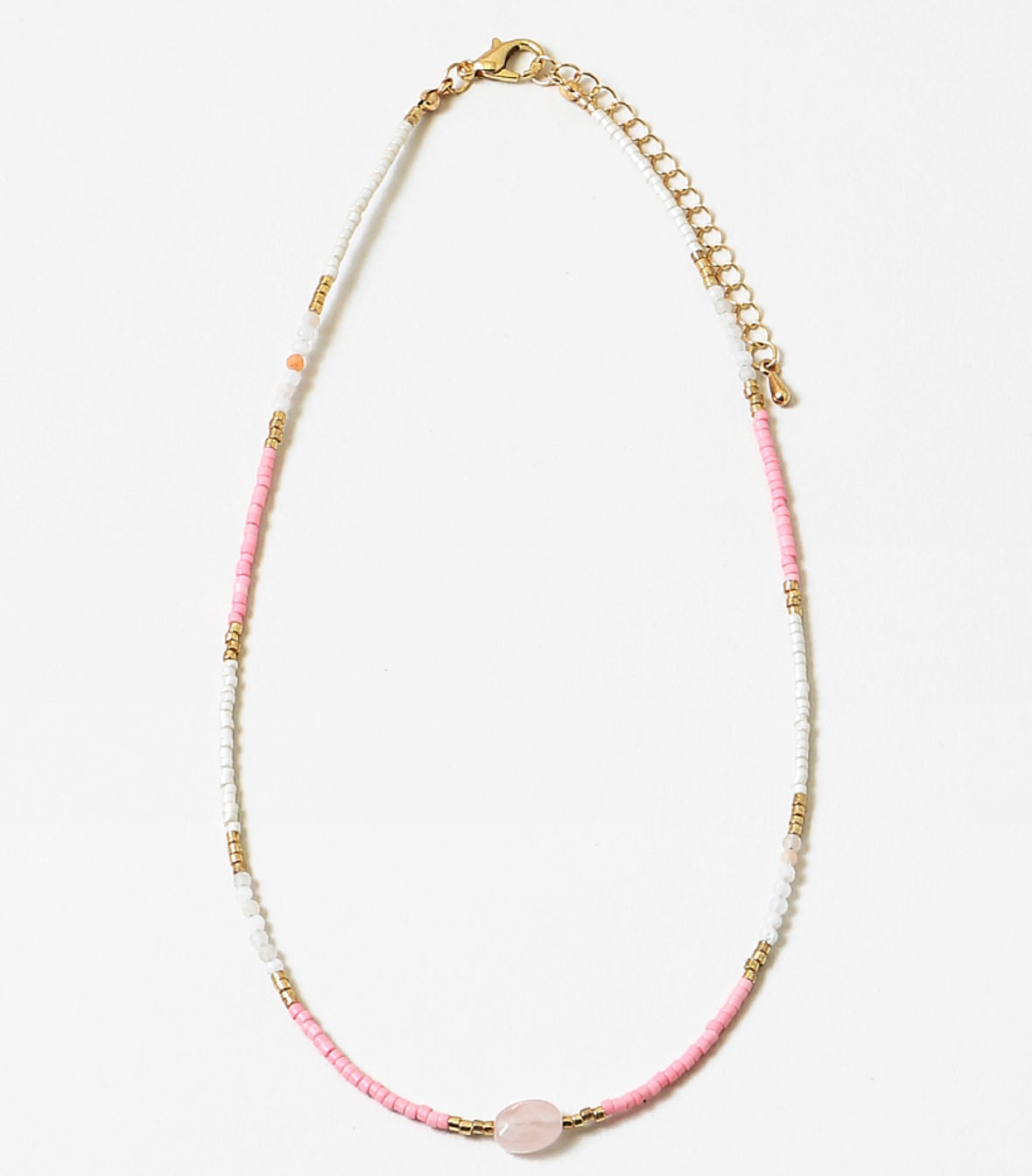 Necklace with pink, whitewith a central pink stone on a white background