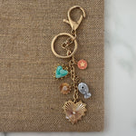 Keychain with various charms on a textured surface