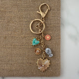 Keychain with various charms on a textured surface