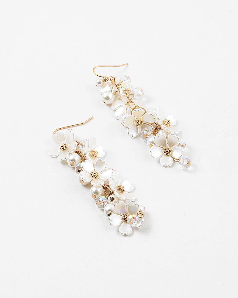 Picture of dangle earrings with white stacked dogwood flowers
