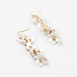 Picture of dangle earrings with white stacked dogwood flowers