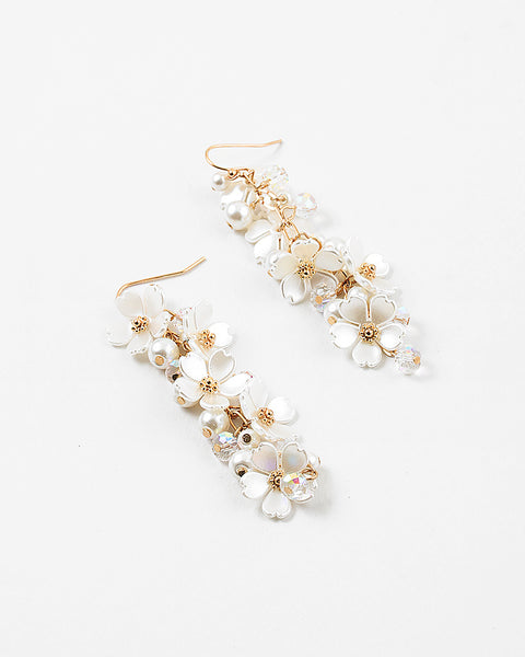 Picture of dangle earrings with white stacked dogwood flowers