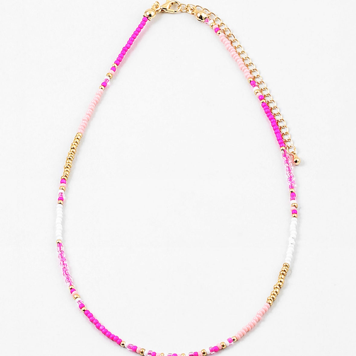 Dainty bead necklace in dark pink, light pink, gold and white beads.