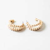 Triple hoops threaded through small wooden beads.