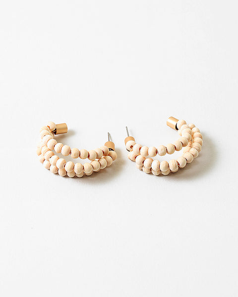 Triple hoops threaded through small wooden beads.