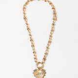 Gold chain toggle necklace with a gold heart medallion that says Love on it