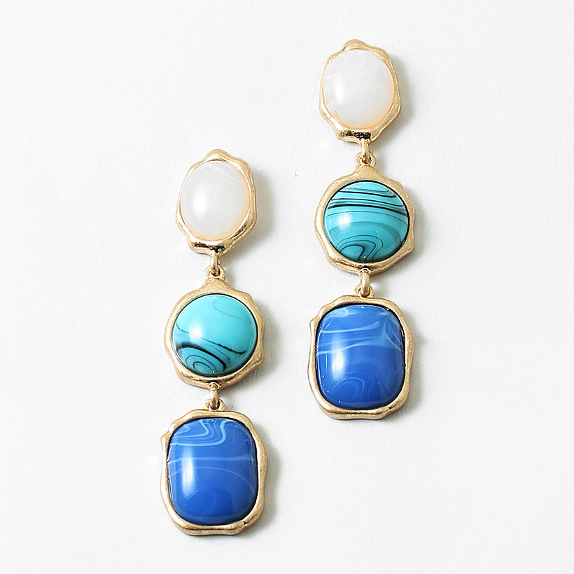 Set of three dangle earrings in gold with white, turquoise and blue stones.