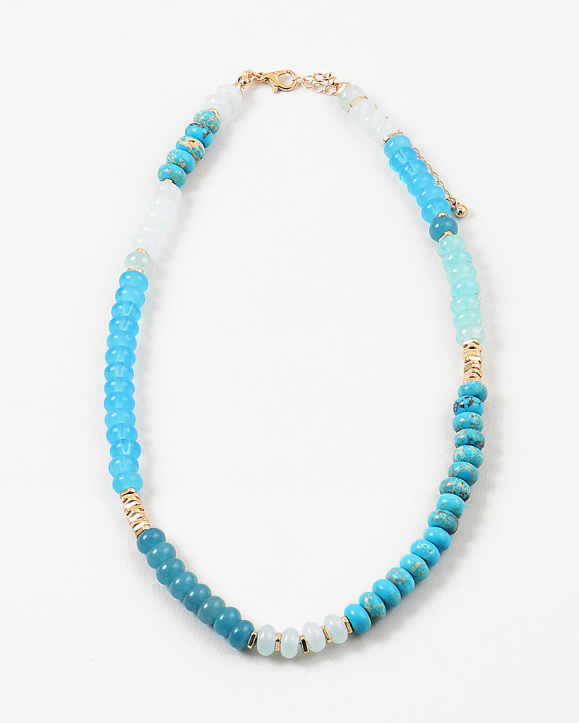 Picture of a blue and white beaded necklace with gold accent beads.