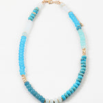 Picture of a blue and white beaded necklace with gold accent beads.