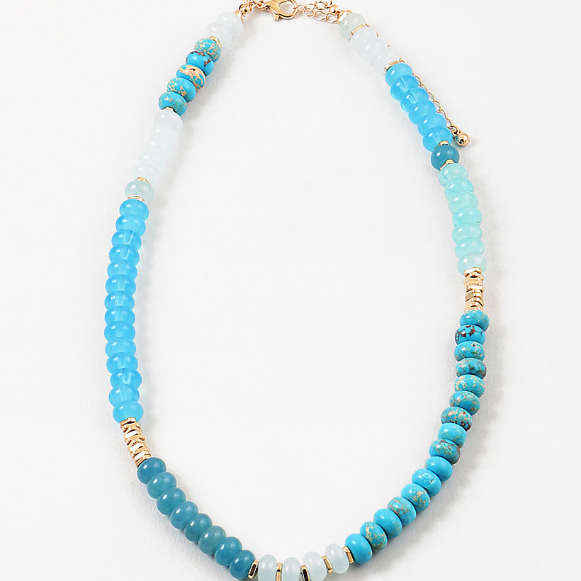 Picture of a blue and white beaded necklace with gold accent beads.