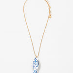 Necklace with a blue and white fish pendant on a white background