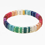 Picture of a bead bracelet in greens, whites, pinks, reds, purples and blues