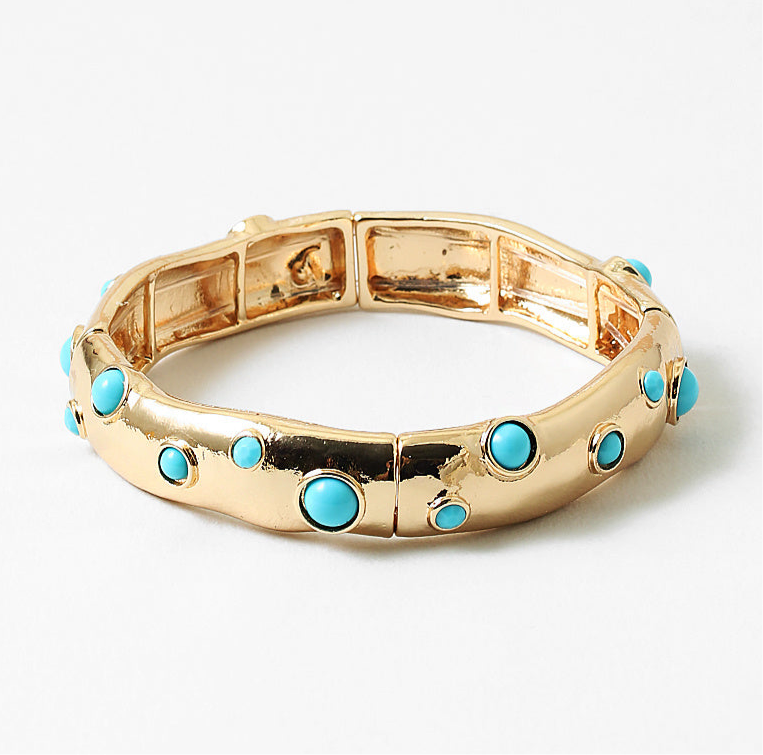 Gold cuff style bracelet with turquoise beads inlaid.