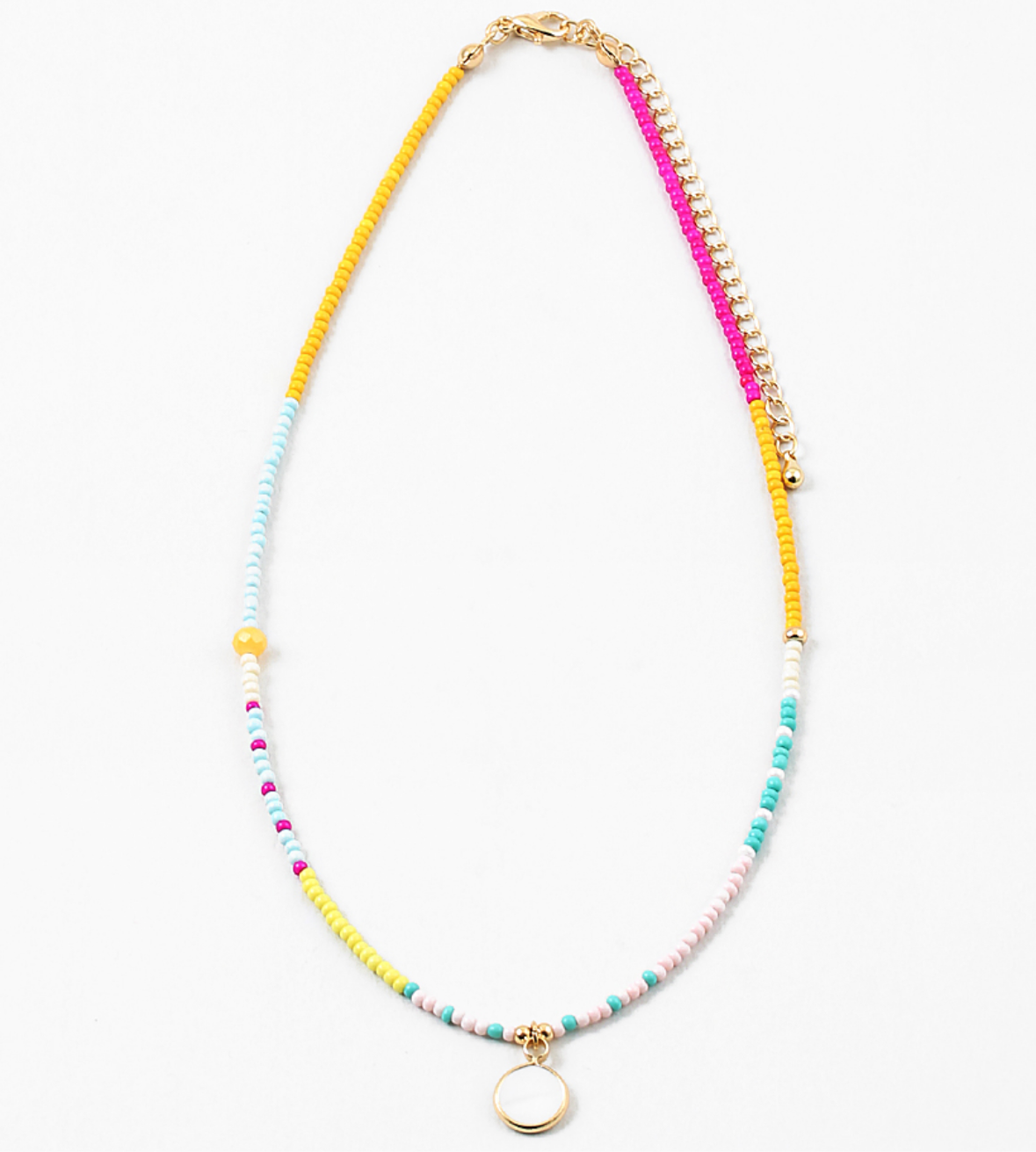 Small bead necklace in yellow, pink, turquoise and white beads. Necklace has a small white enamel disc pendant at its center.