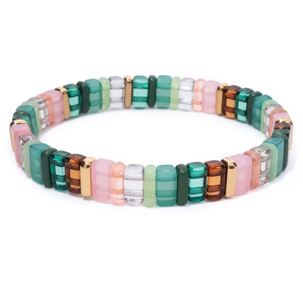 Picture of a bead bracelet in teals, browns, pinks and clear beads.