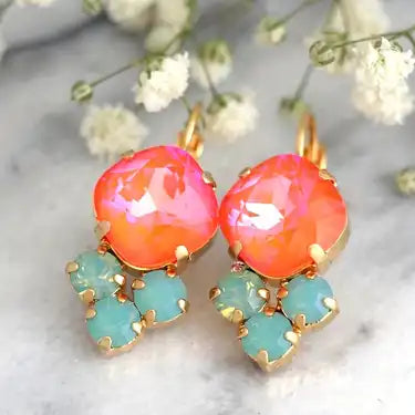 Picture of coral colored stone earrings with three accenting Mint green stones below.