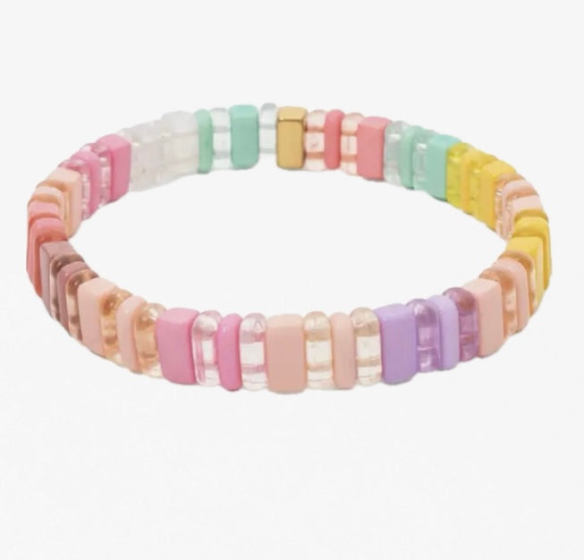 Picture of a light multicolored bead bracelet. Beads are clear and solid yellows, peaches, greens and purple.