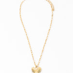Gold necklace with a heart-shaped pendant on a white background