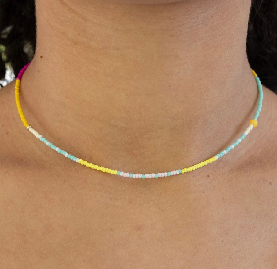 Colorful beaded necklace on a person's neck