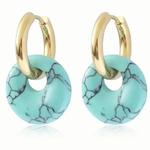 A set of small gold hoop earrings with turquoise hoops on them.