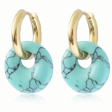 A set of small gold hoop earrings with turquoise hoops on them.
