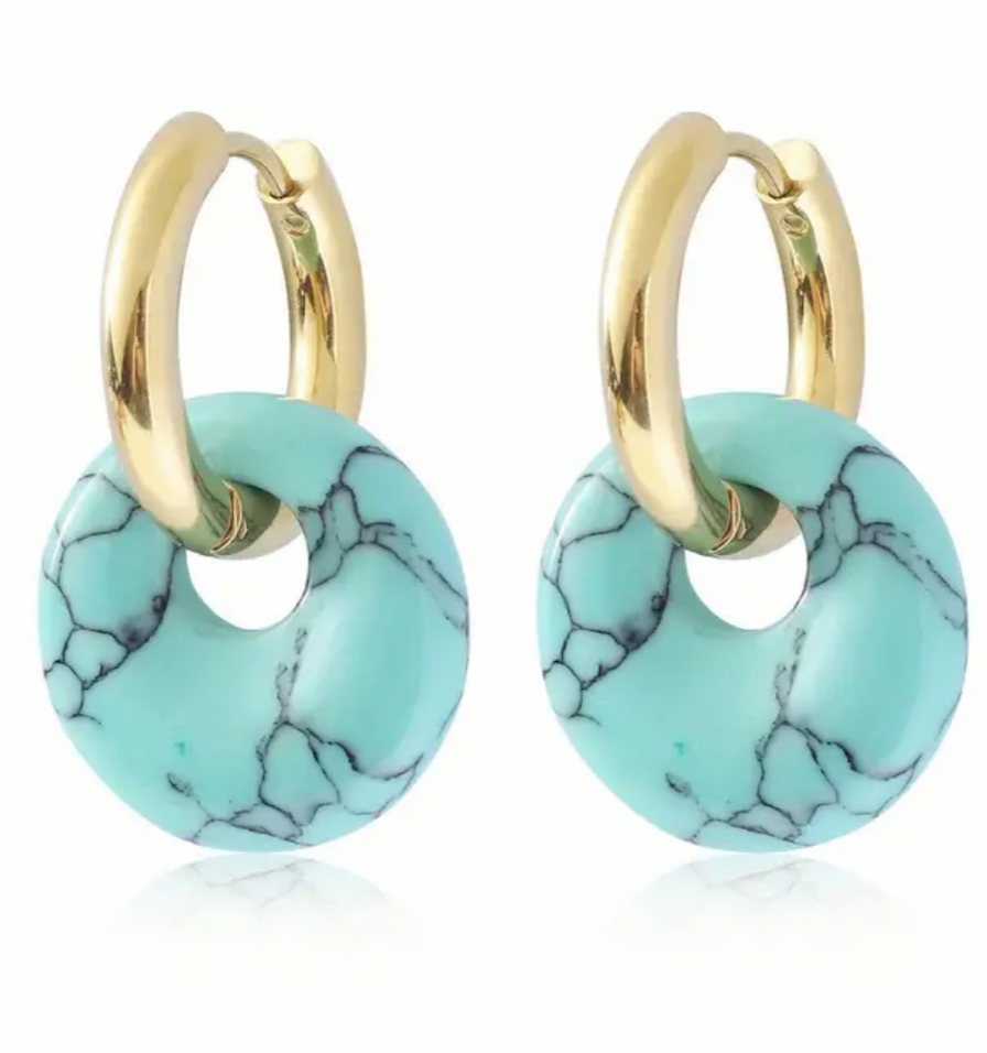 A set of small gold hoop earrings with turquoise hoops on them.
