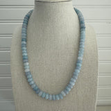 Light blue beaded necklace made out of semi-precious stones.