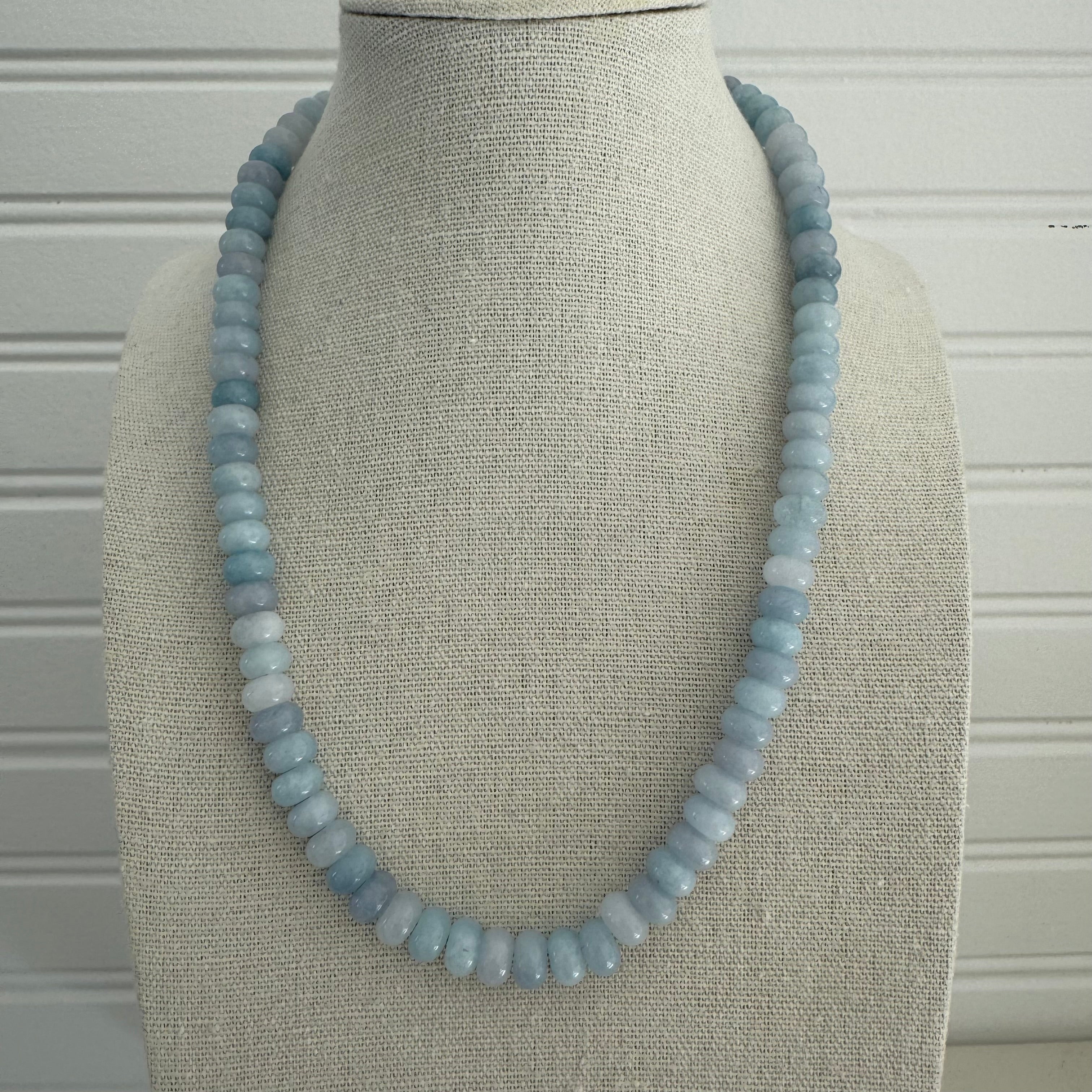 Light blue beaded necklace made out of semi-precious stones.