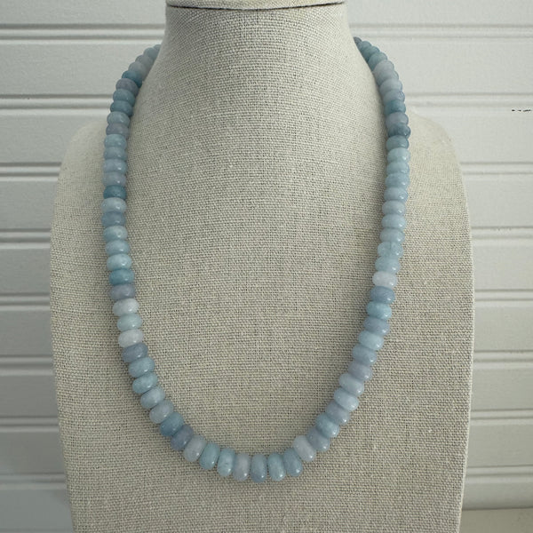 Light blue beaded necklace made out of semi-precious stones.