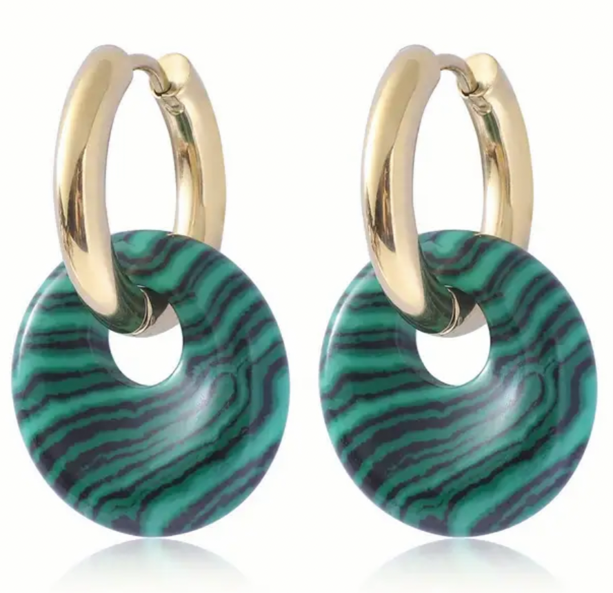 Set of earrings with small gold hoops that have green striped discs threaded through them.