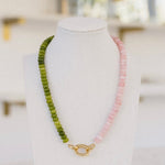 Olive green and rose colored beaded necklace with a gold clasp.