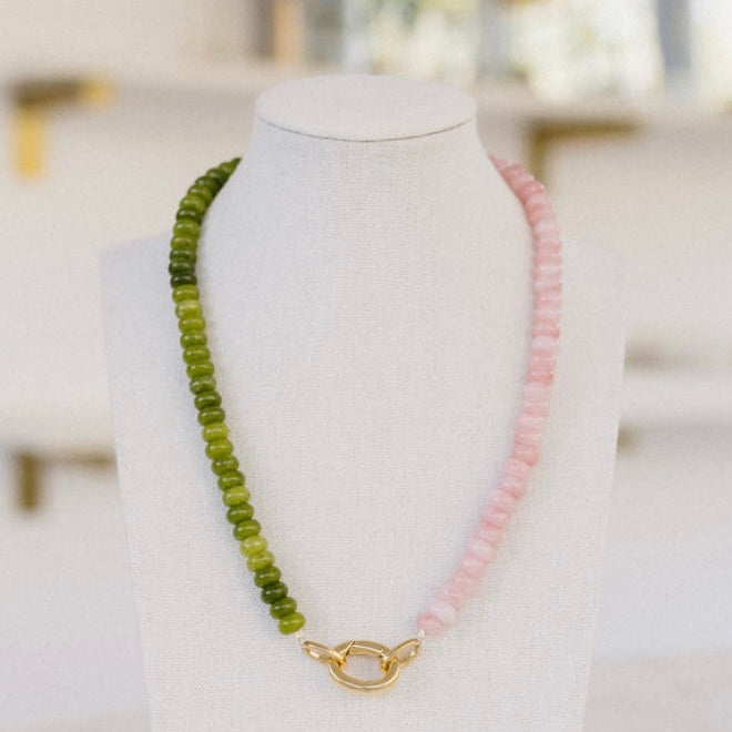Olive green and rose colored beaded necklace with a gold clasp.