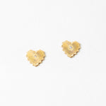 Gold heart-shaped earrings on a white background