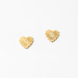 Gold heart-shaped earrings on a white background
