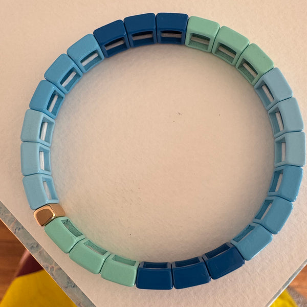 Square bead bracelet in ombre shades of muted blues.