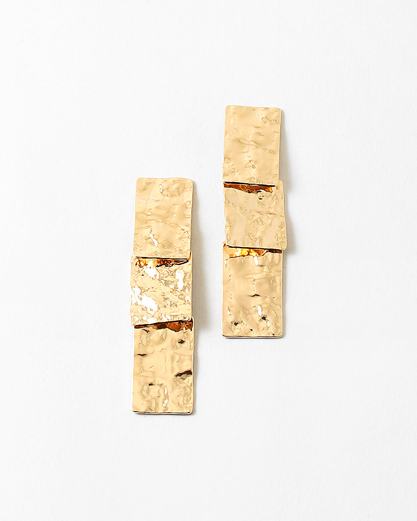 Hammered gold rectangles stacked into dangling earrings