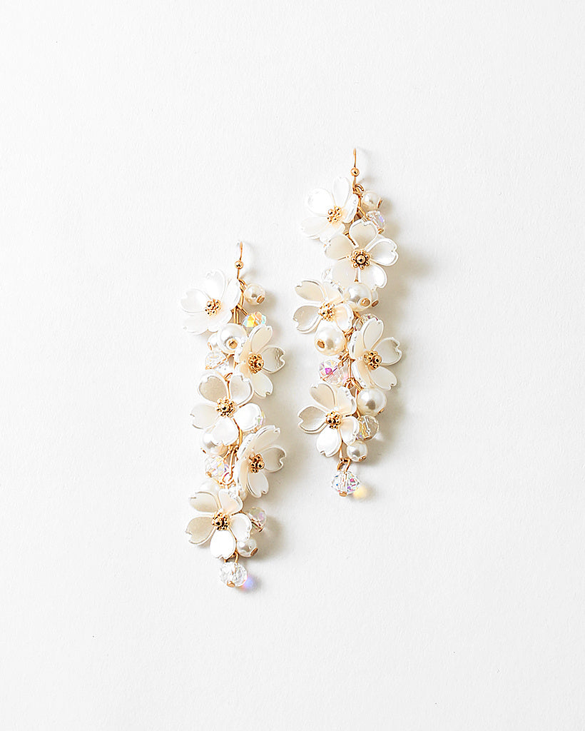 Picture of dangle earrings made of vertically stacked white dogwood flowers