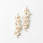 Picture of dangle earrings made of vertically stacked white dogwood flowers