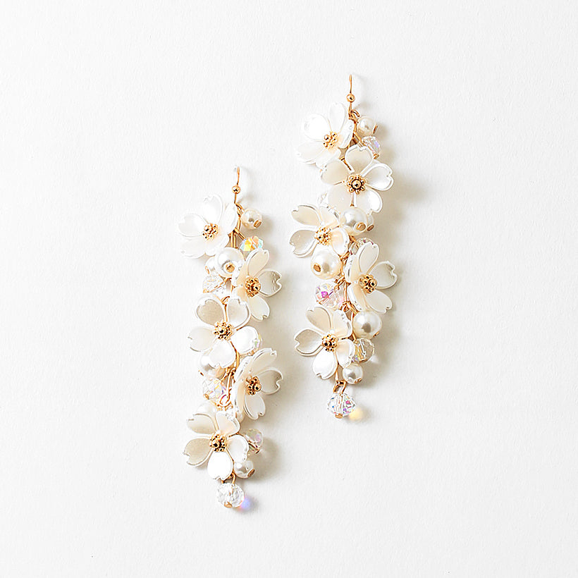 Picture of dangle earrings made of vertically stacked white dogwood flowers