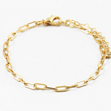 Gold chain bracelet on a white background