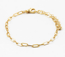 Gold chain bracelet on a white background