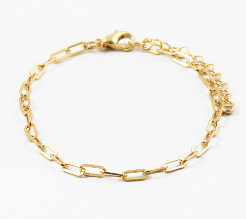 Gold chain bracelet on a white background
