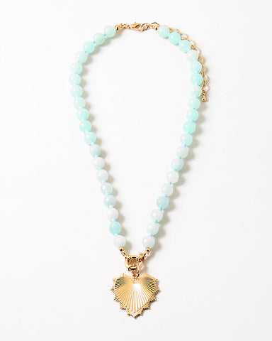 Light green beaded necklace with a gold heart charm.