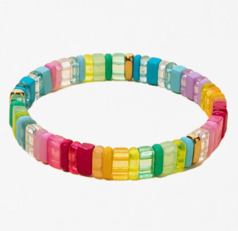 Multicolored bracelet made out of rectangle beads that vary between clear and solid color of reds, yellows, greens and blues.