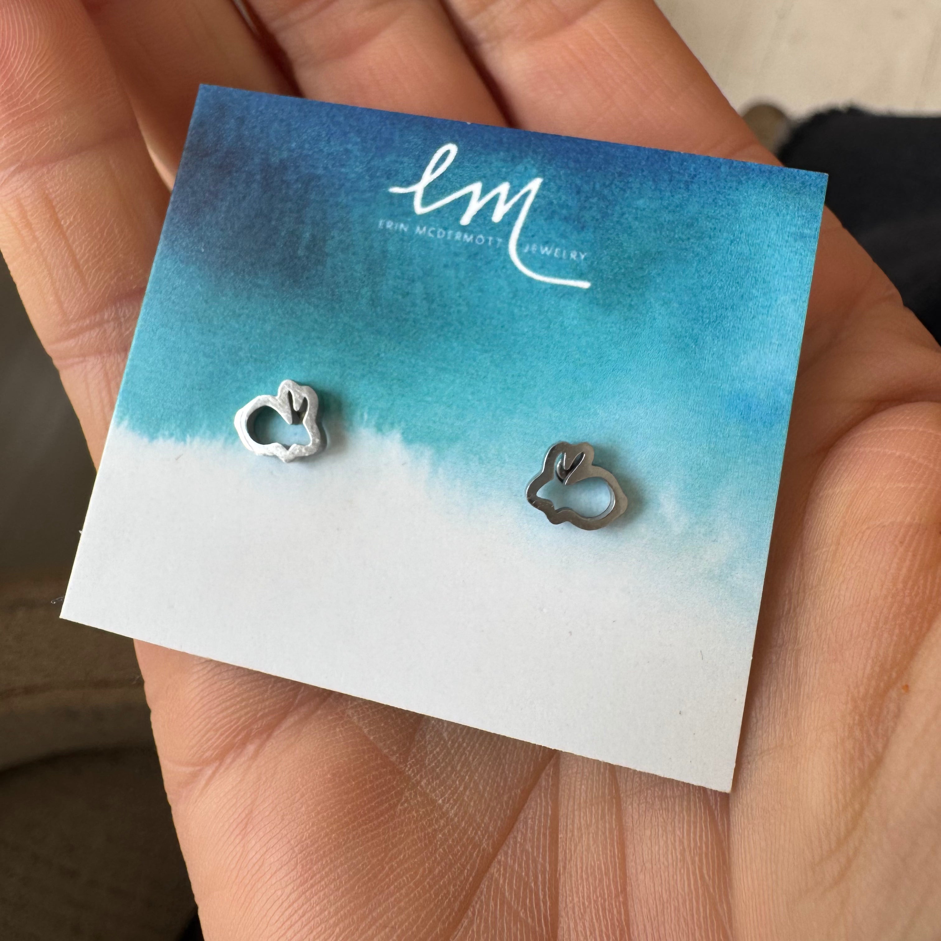 Picture of a large gold Link charm bracelet with 5 Easter themed charms. 4 are colorful Easter eggs and one is a white bunny.