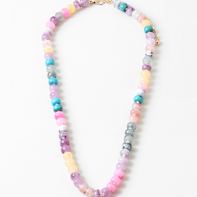 Resin bead necklace in pinks, purples and creams.