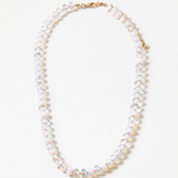 Resin bead necklace with clear and opaque stones.