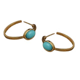 Gold hoop earrings with turquoise stones on a white background